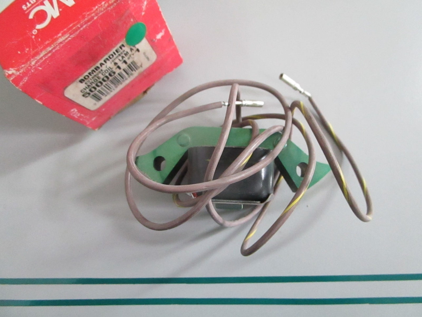 NEW OEM 5000611 OMC Johnson Evinrude Charge Coil & Lam Assy 0820