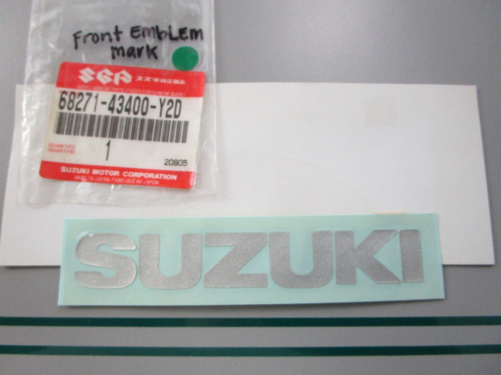 NEW OEM 68271-43400-Y2D Suzuki Front Emblem Mark 0810