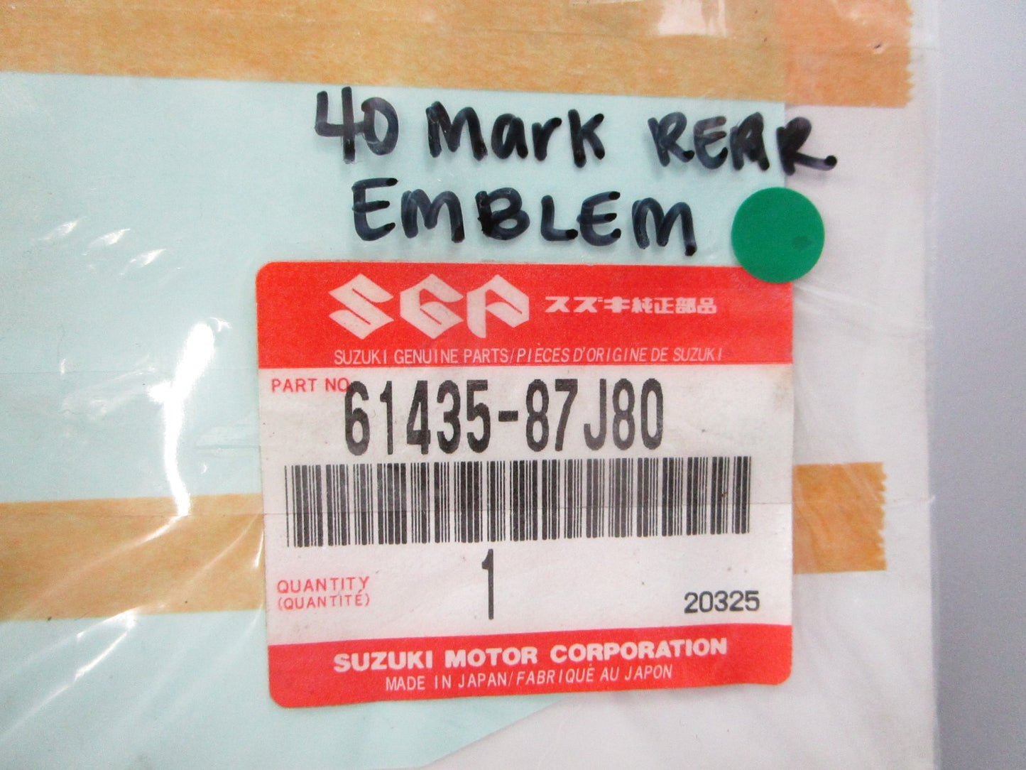 NEW OEM 61435-87J80 Suzuki 40 Mark Rear Emblem 0810