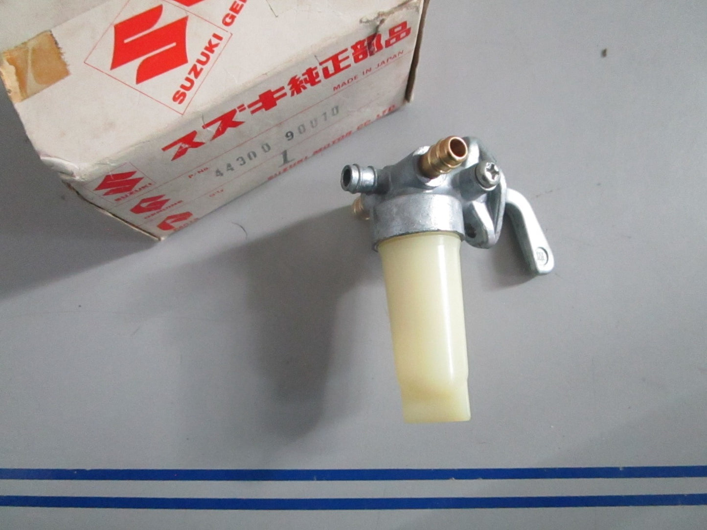 NEW OEM 44300-90010 Suzuki Fuel Cock Assy 0820