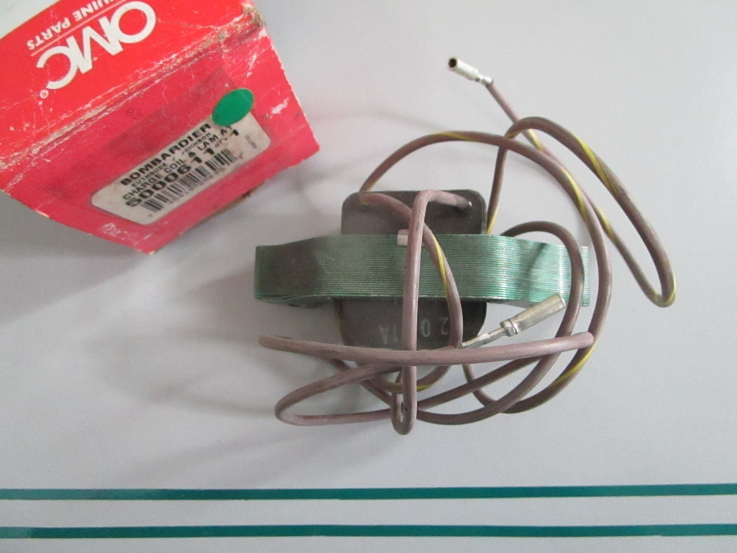 NEW OEM 5000611 OMC Johnson Evinrude Charge Coil & Lam Assy 0820