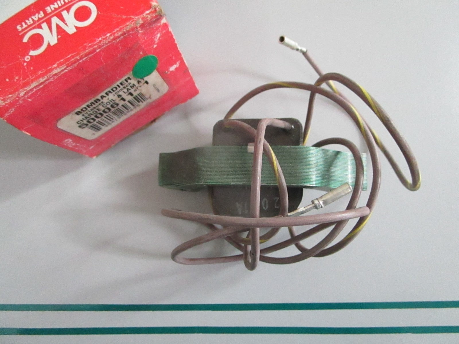NEW OEM 5000611 OMC Johnson Evinrude Charge Coil & Lam Assy 0820