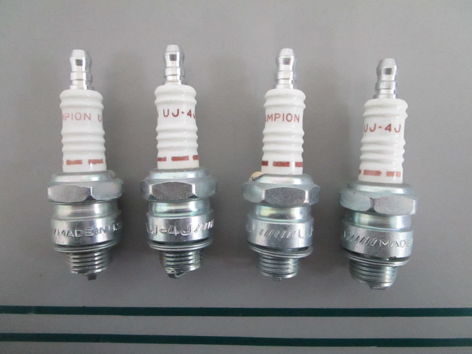 NEW OEM (LOT OF 4) UJ-4J Champion Spark Plug 0820