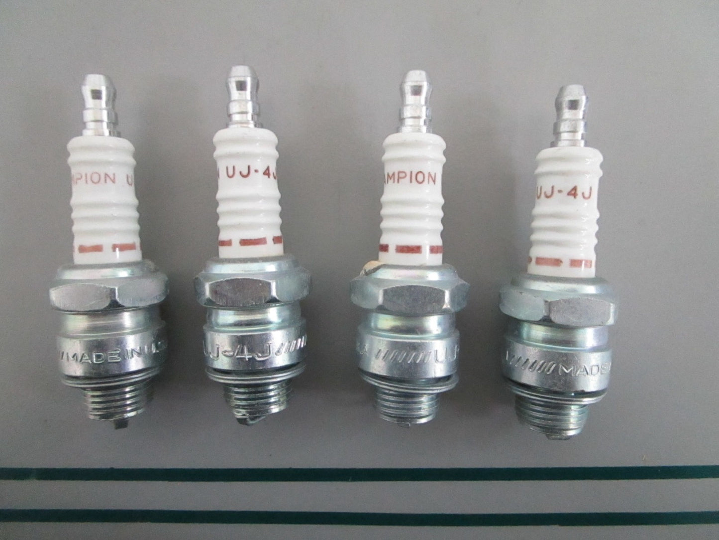 NEW OEM (LOT OF 4) UJ-4J Champion Spark Plug 0820