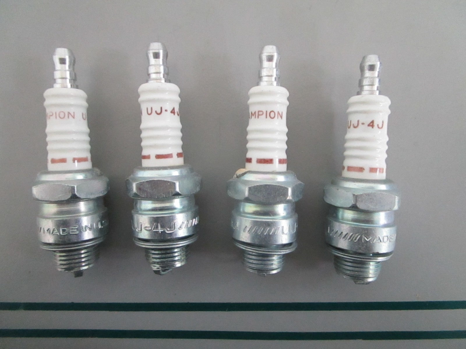 NEW OEM (LOT OF 4) UJ-4J Champion Spark Plug 0820