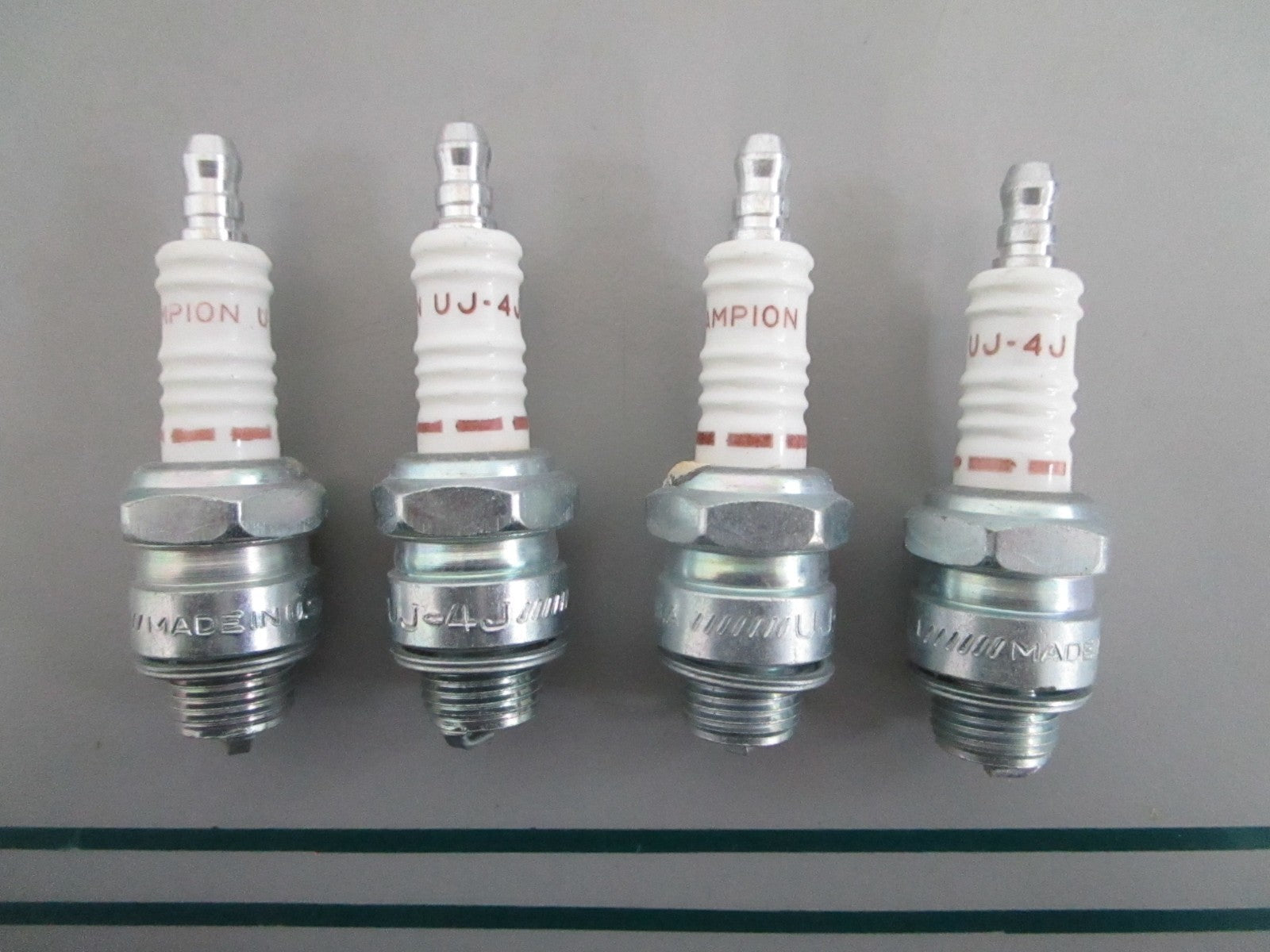 NEW OEM (LOT OF 4) UJ-4J Champion Spark Plug 0820