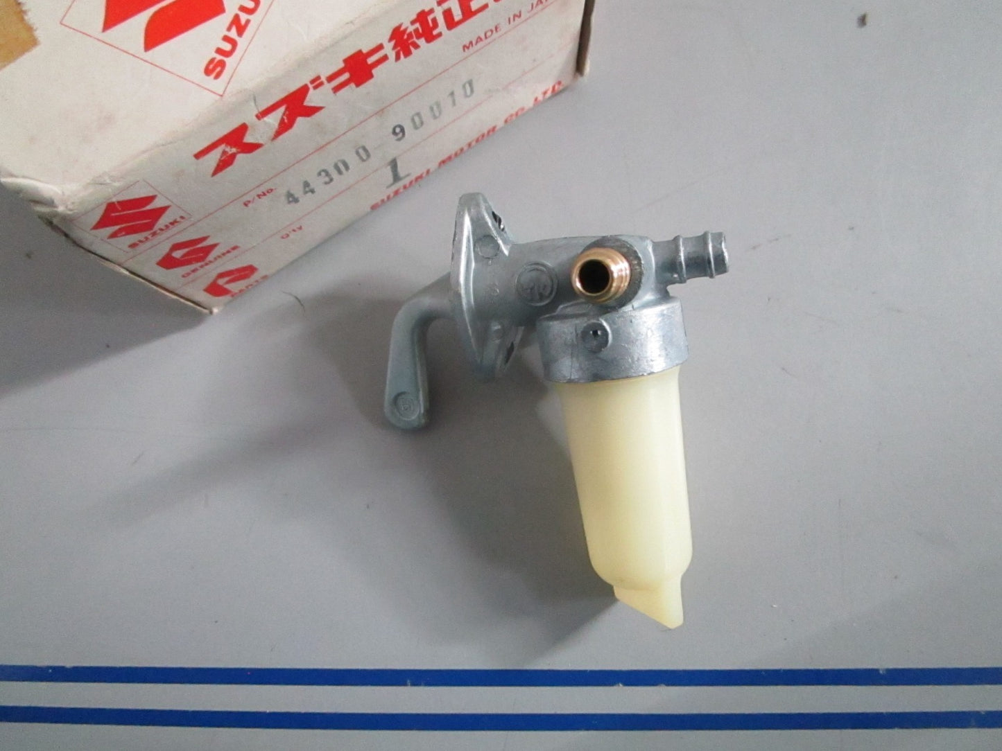 NEW OEM 44300-90010 Suzuki Fuel Cock Assy 0820