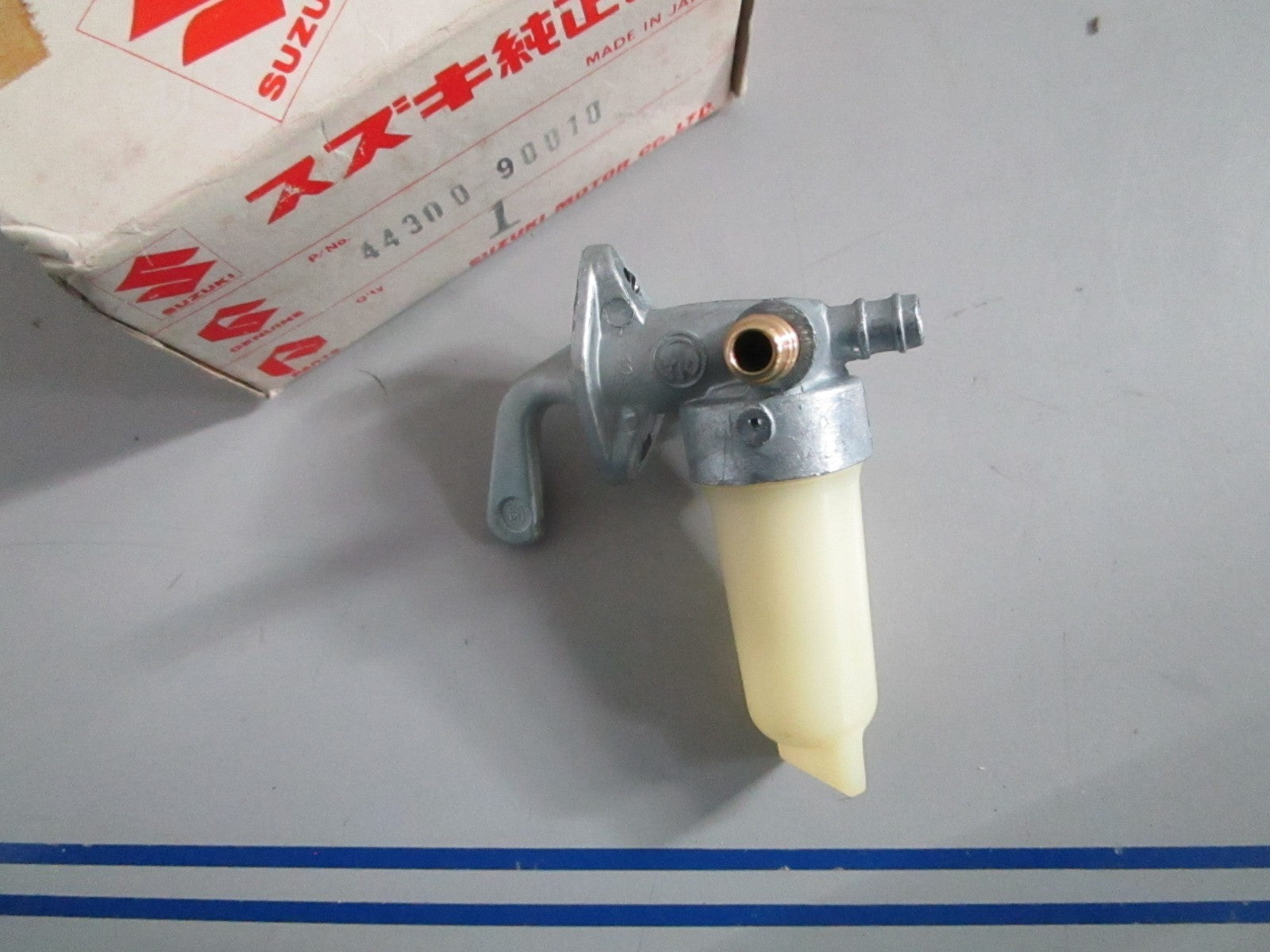 NEW OEM 44300-90010 Suzuki Fuel Cock Assy 0820