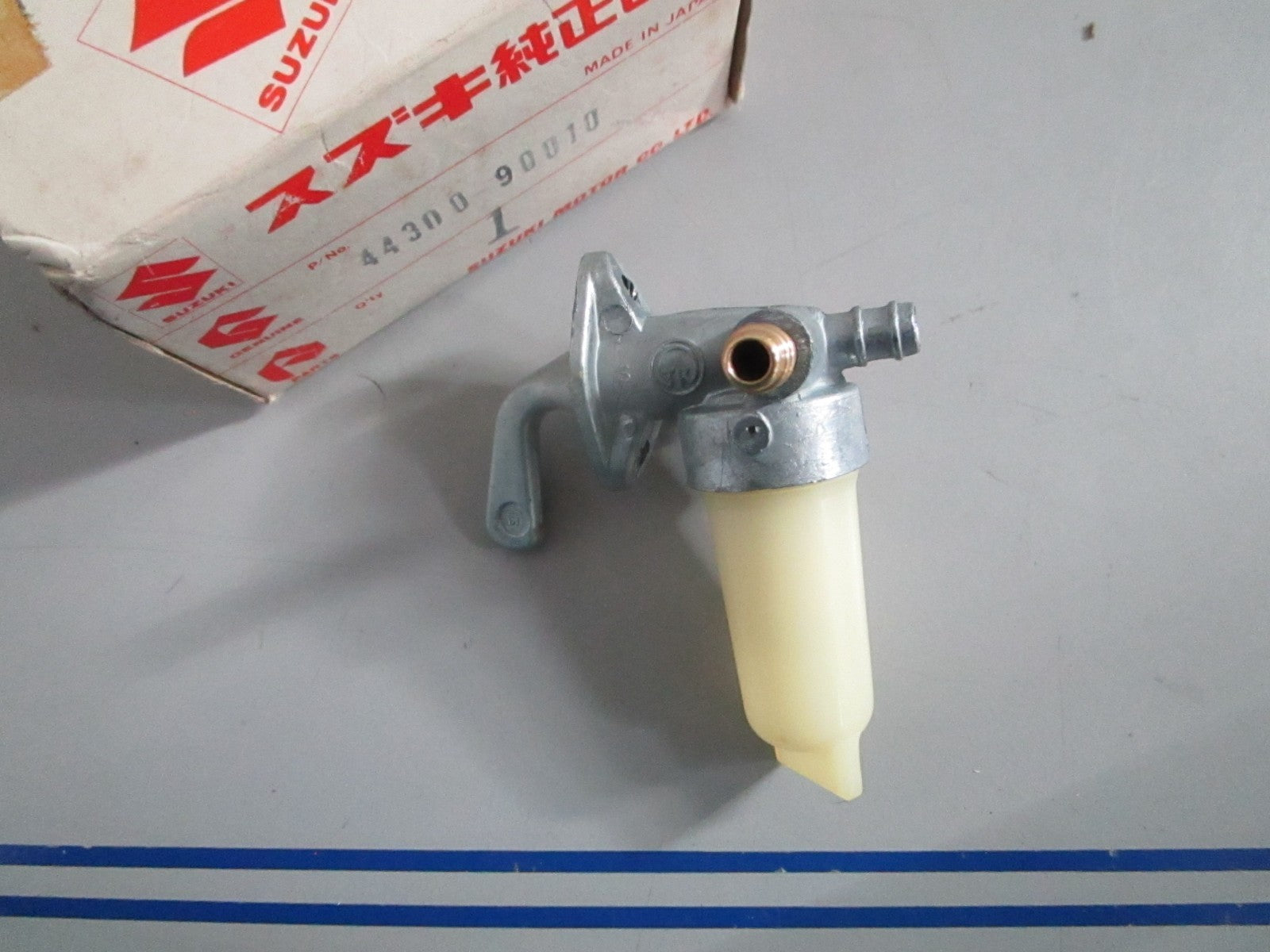 NEW OEM 44300-90010 Suzuki Fuel Cock Assy 0820