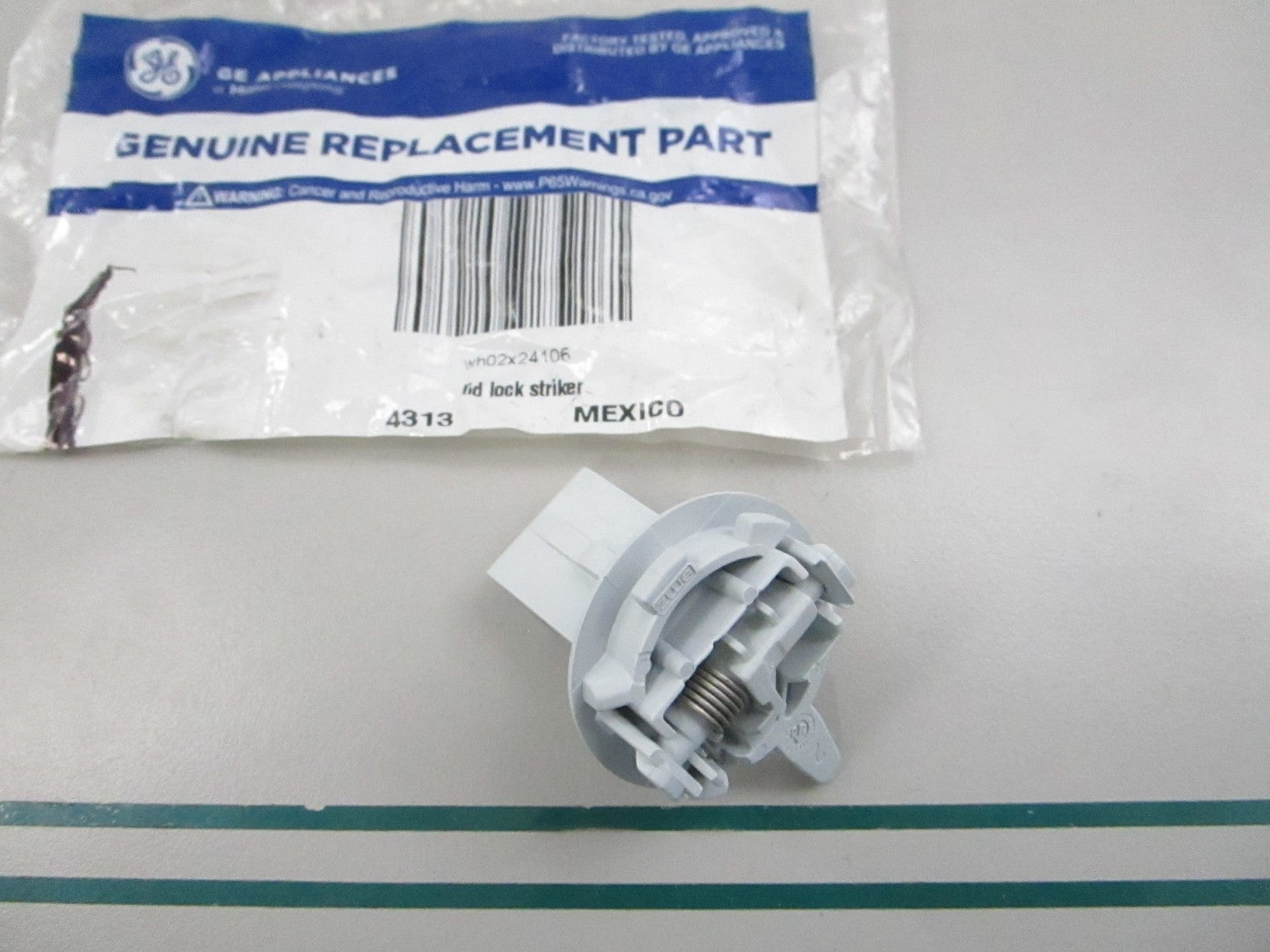 NEW OEM WH02X24106 GE Lid Lock Striker 0810