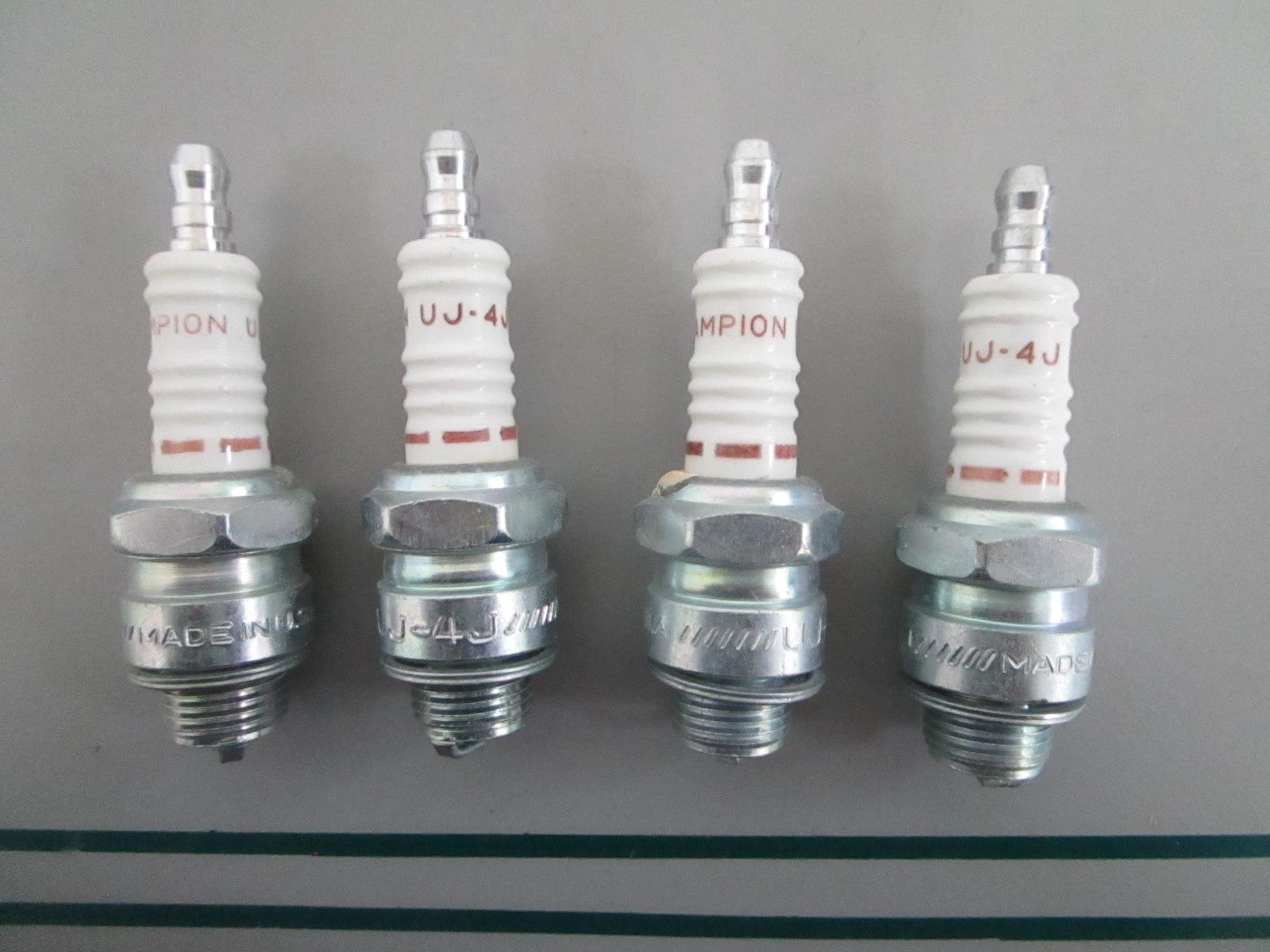 NEW OEM (LOT OF 4) UJ-4J Champion Spark Plug 0820