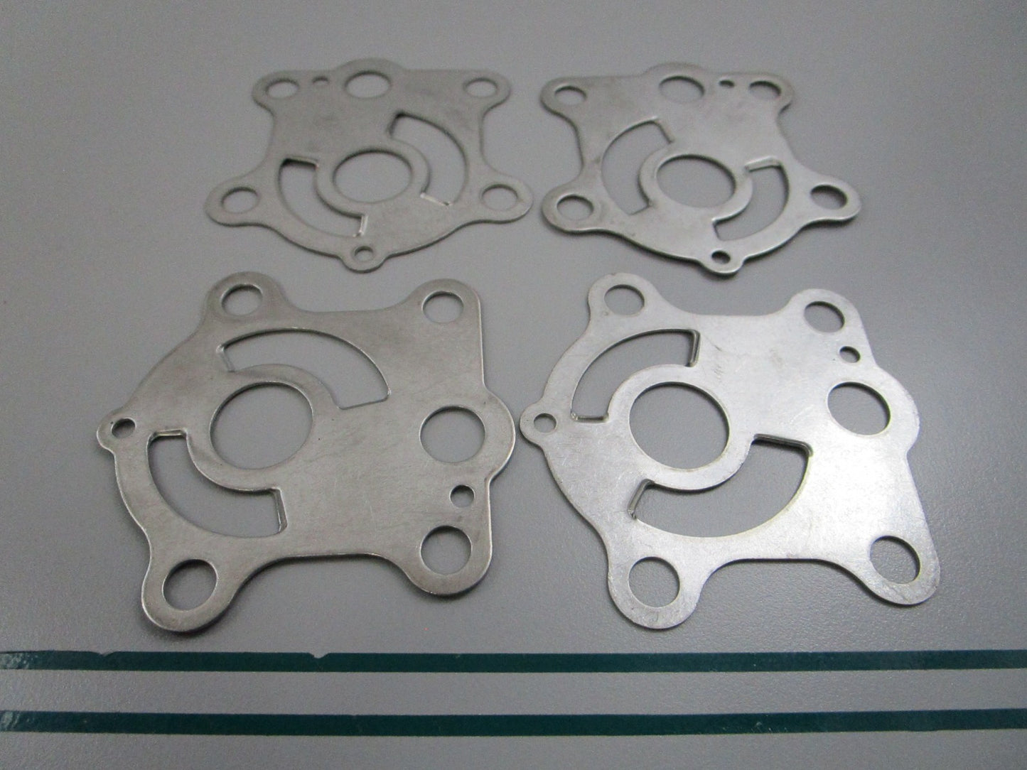 NEW OEM (LOT OF 4) 663-44323-00-00 Yamaha Water Pump Plate 0810