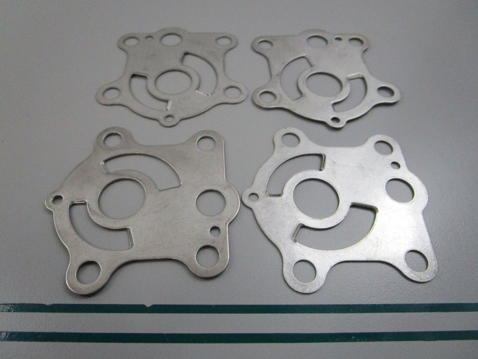 NEW OEM (LOT OF 4) 663-44323-00-00 Yamaha Water Pump Plate 0810
