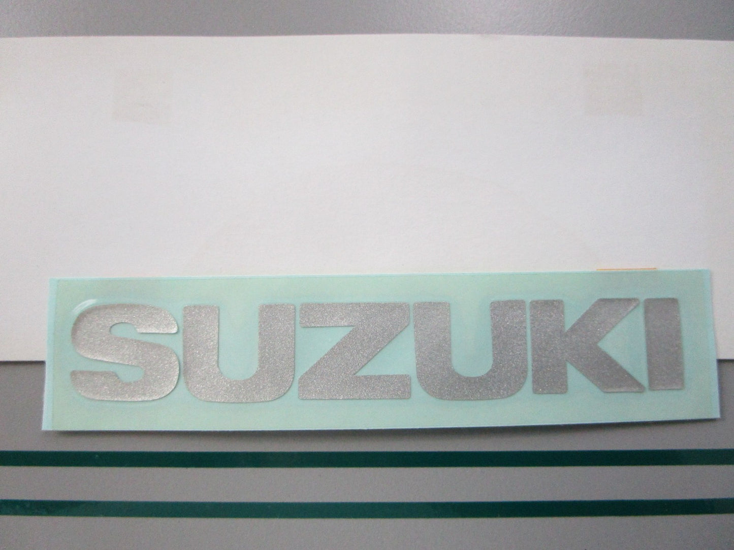 NEW OEM 68271-43400-Y2D Suzuki Front Emblem Mark 0810