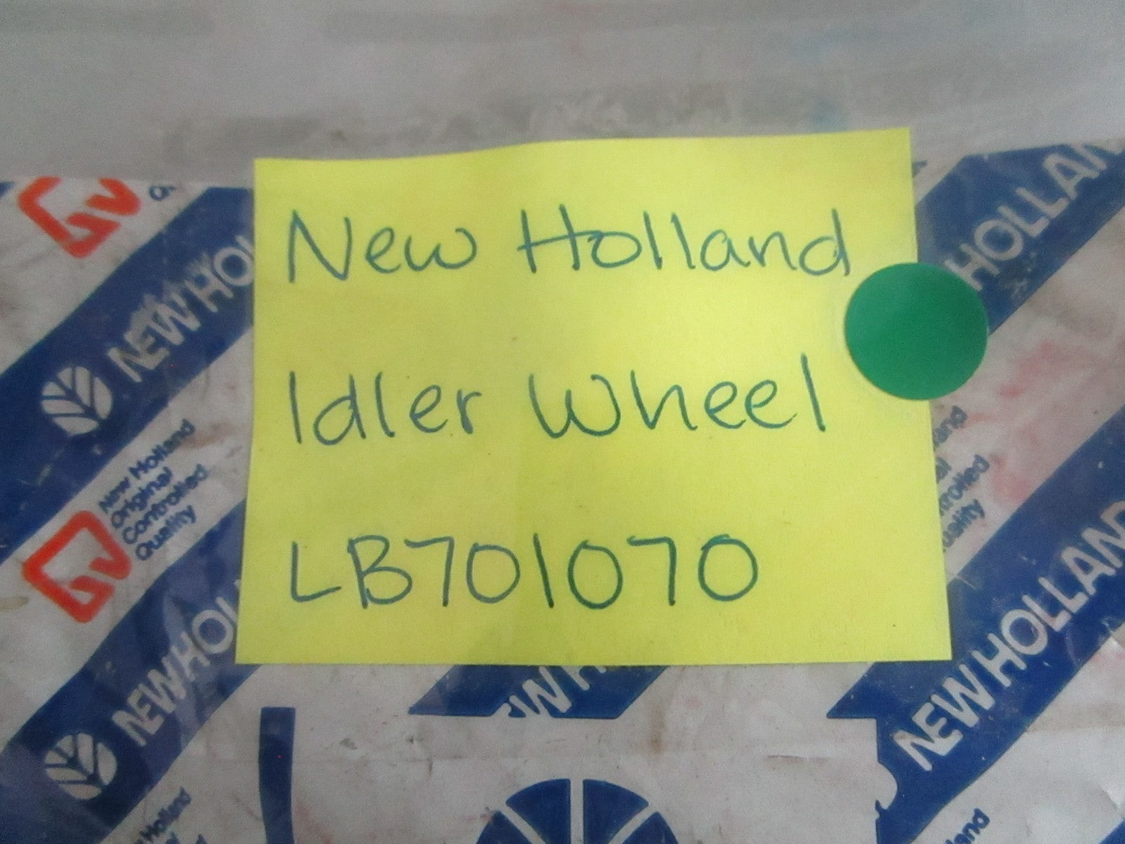 NEW OEM LB701070 New Holland Idler Wheel 0820