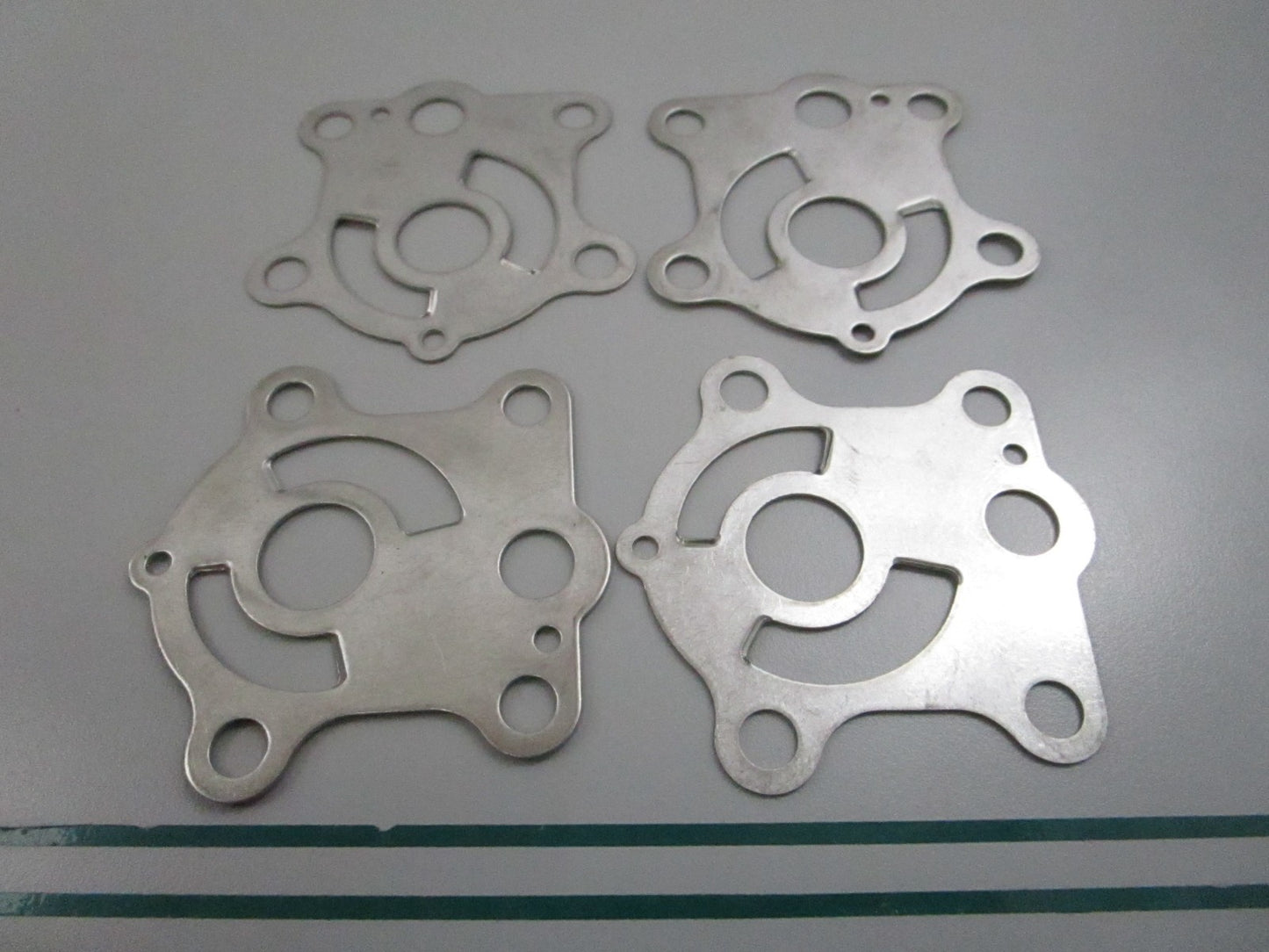 NEW OEM (LOT OF 4) 663-44323-00-00 Yamaha Water Pump Plate 0810