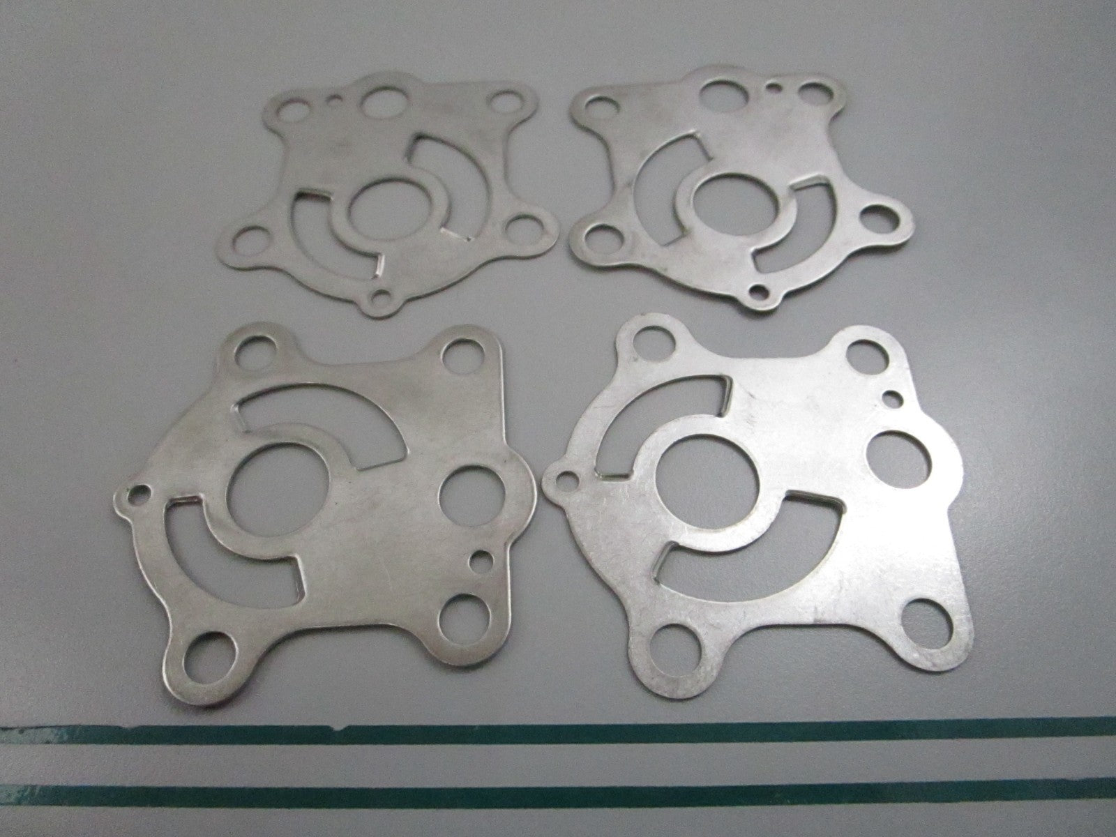 NEW OEM (LOT OF 4) 663-44323-00-00 Yamaha Water Pump Plate 0810